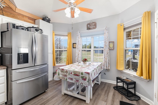 kitchen featuring hardwood / wood-style flooring, ceiling fan, stainless steel fridge with ice dispenser, and white cabinets