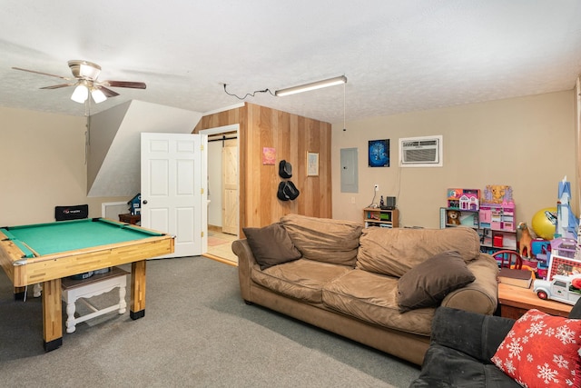 playroom with vaulted ceiling, carpet flooring, a wall mounted AC, electric panel, and ceiling fan