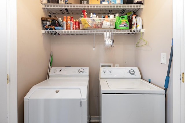 clothes washing area with washer and dryer