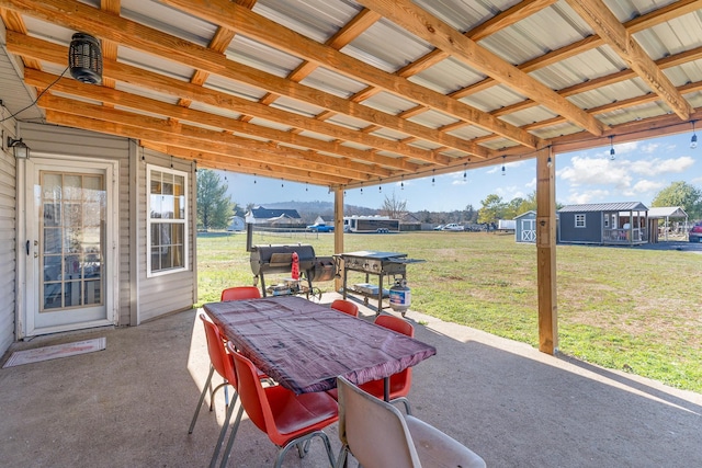 view of patio featuring a storage shed