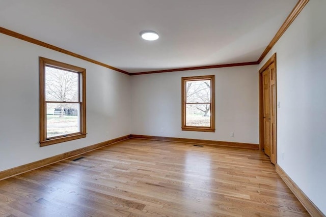 unfurnished room with light hardwood / wood-style flooring and ornamental molding