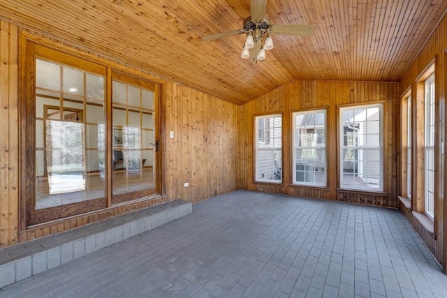 unfurnished sunroom with ceiling fan, lofted ceiling, and wood ceiling