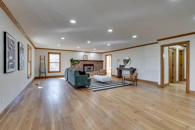 unfurnished living room with ornamental molding, a fireplace, and light hardwood / wood-style floors