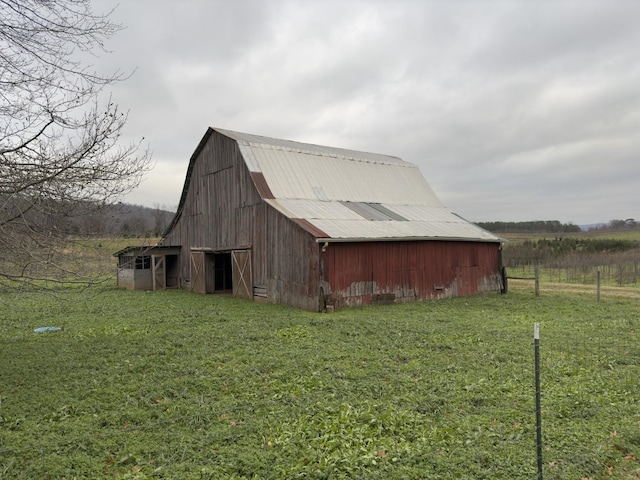 view of outdoor structure with a lawn