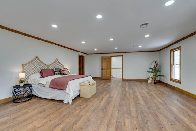 bedroom featuring hardwood / wood-style floors and ornamental molding