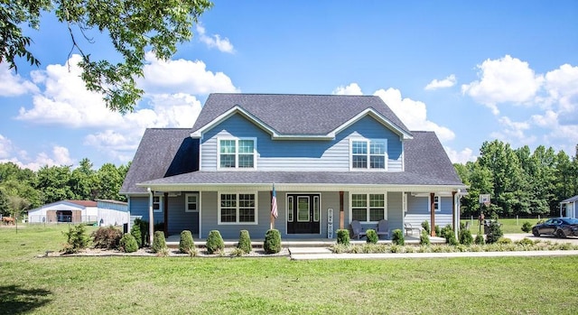 view of front of property with a porch and a front lawn