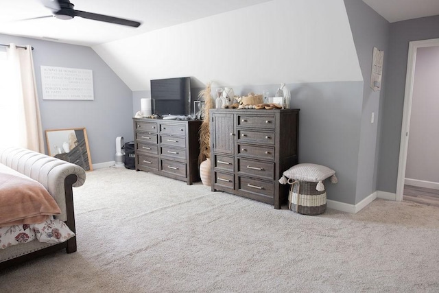 bedroom with lofted ceiling, light colored carpet, and ceiling fan