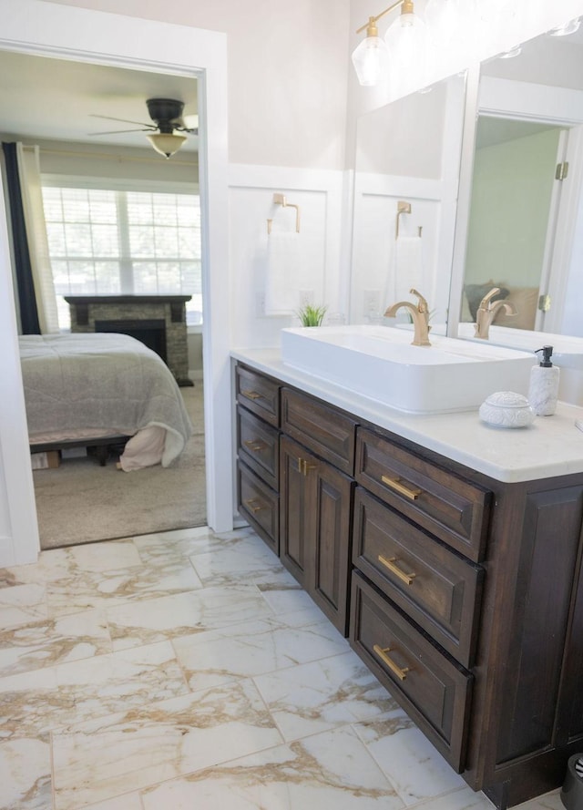 bathroom featuring ceiling fan and vanity