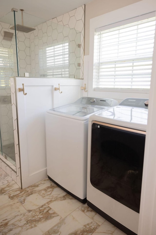 laundry area with washing machine and dryer