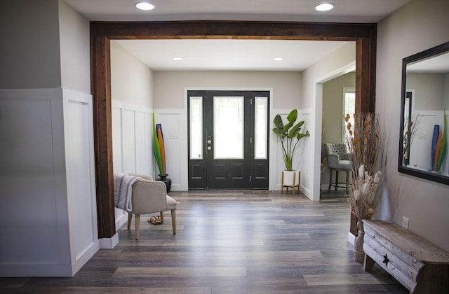 entryway featuring dark wood-type flooring and plenty of natural light