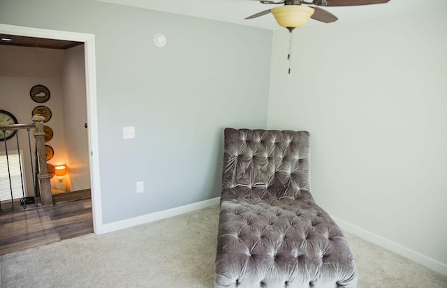 living area featuring carpet floors