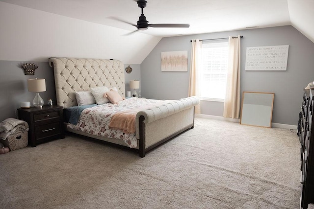 carpeted bedroom featuring vaulted ceiling and ceiling fan