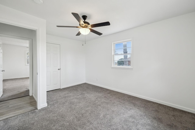 carpeted empty room with ceiling fan