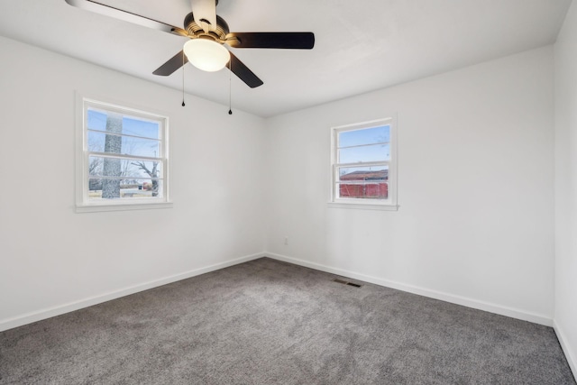 carpeted empty room with ceiling fan