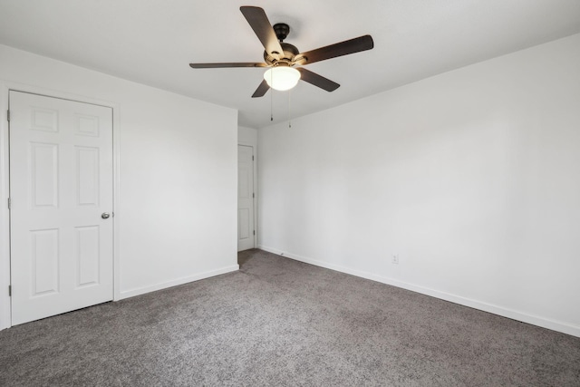 carpeted empty room with ceiling fan