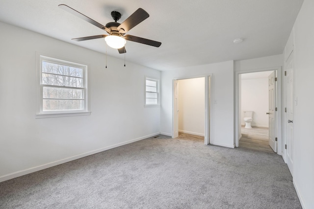 unfurnished bedroom with light colored carpet and ceiling fan