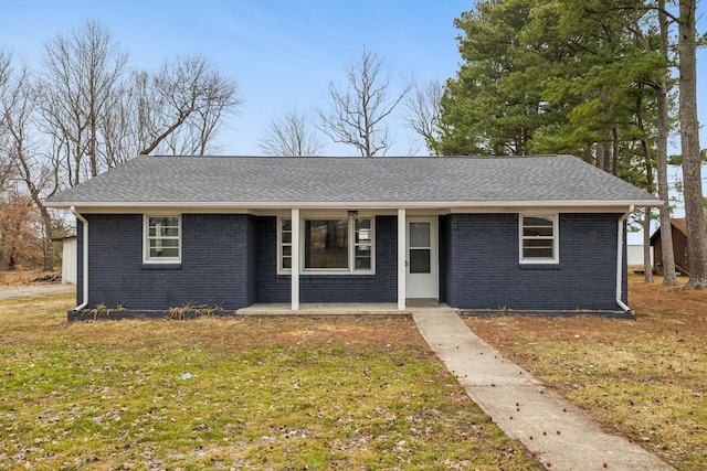 ranch-style house with a front lawn