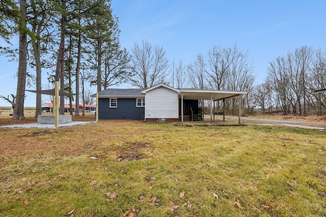 exterior space with a front yard and a carport