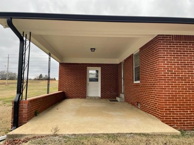 view of patio / terrace with a carport