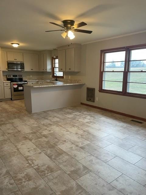 kitchen with crown molding, appliances with stainless steel finishes, sink, and kitchen peninsula