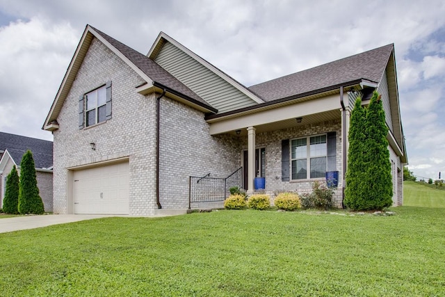 view of front of property with a garage and a front lawn