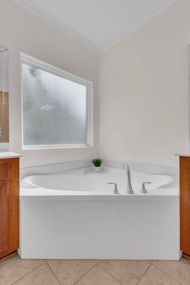 bathroom featuring vanity, ornamental molding, a bath, and tile patterned floors