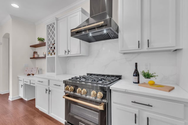 kitchen featuring white cabinetry, tasteful backsplash, dark hardwood / wood-style flooring, high end stainless steel range oven, and range hood