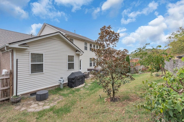 rear view of house with a lawn