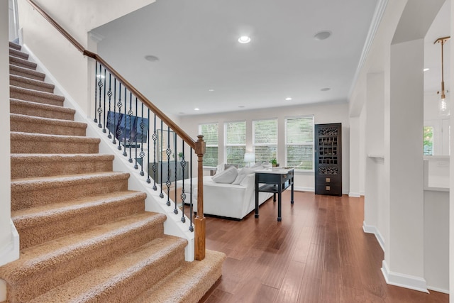 living room with crown molding and dark hardwood / wood-style floors