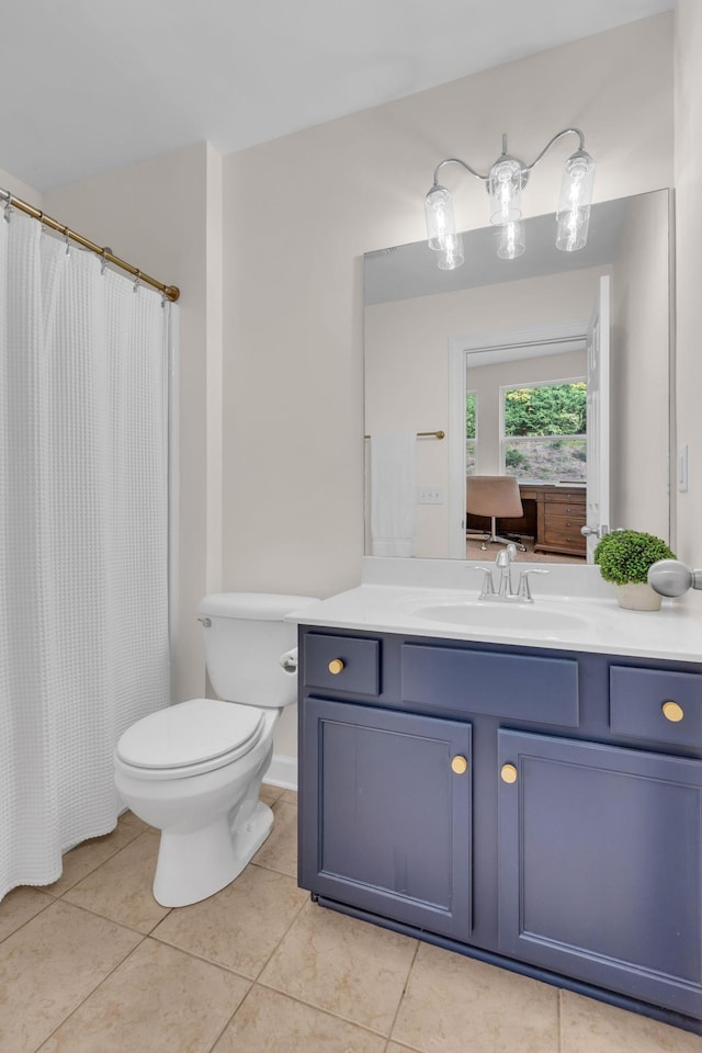 bathroom with tile patterned floors, toilet, and vanity