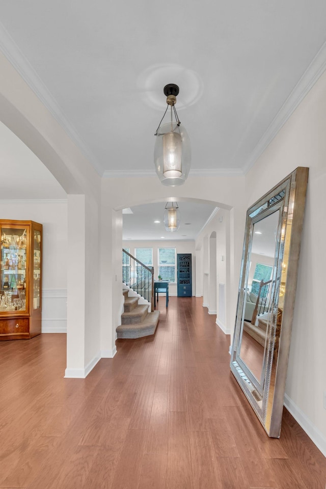 hall featuring crown molding and wood-type flooring