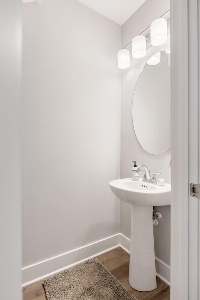 bathroom with sink and hardwood / wood-style floors