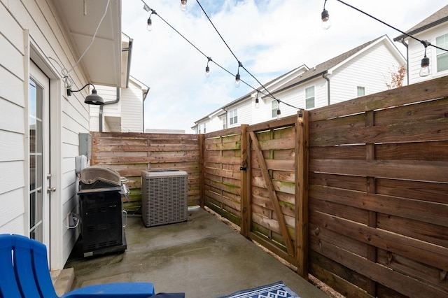 view of patio featuring a grill and central AC