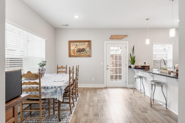 dining room with light hardwood / wood-style flooring