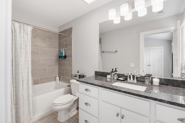 full bathroom featuring tile patterned floors, toilet, vanity, and shower / bath combo