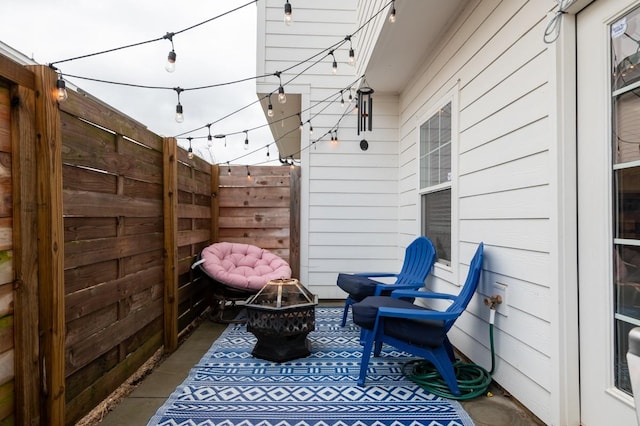 view of patio / terrace with a fire pit