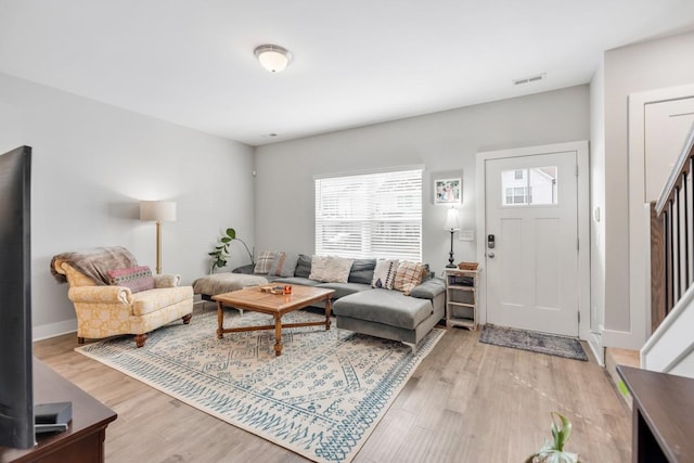 living room with light hardwood / wood-style flooring