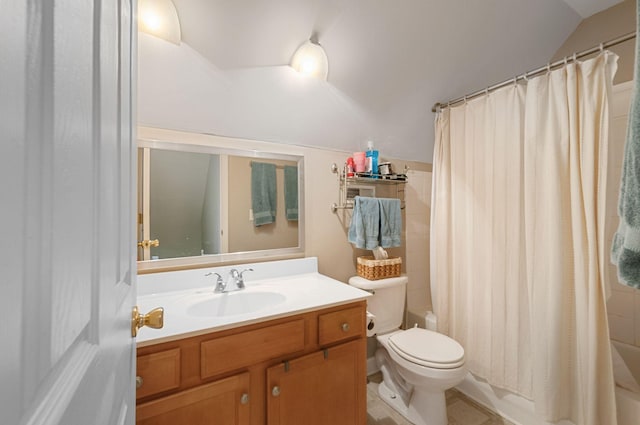 full bathroom featuring lofted ceiling, shower / tub combo, vanity, tile patterned floors, and toilet