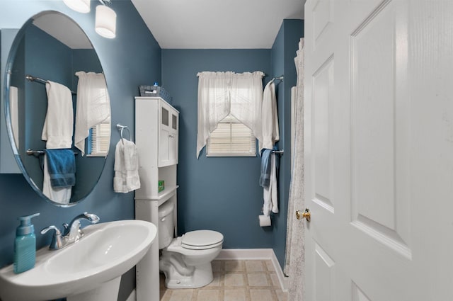 bathroom featuring toilet and sink