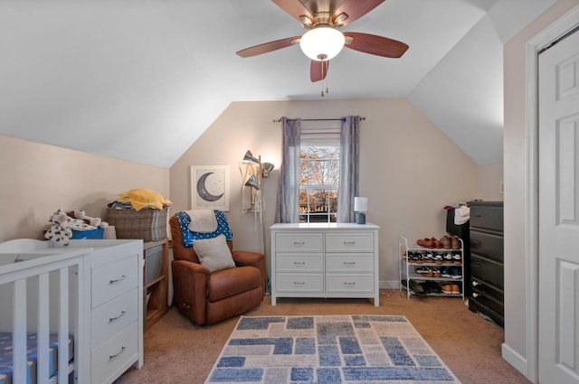 carpeted bedroom featuring ceiling fan and vaulted ceiling