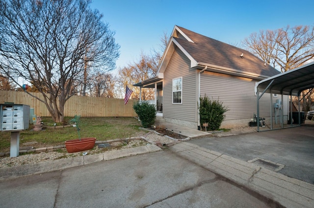 view of property exterior featuring a carport