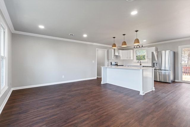 kitchen with a kitchen island, white cabinets, hanging light fixtures, stainless steel appliances, and dark wood-type flooring