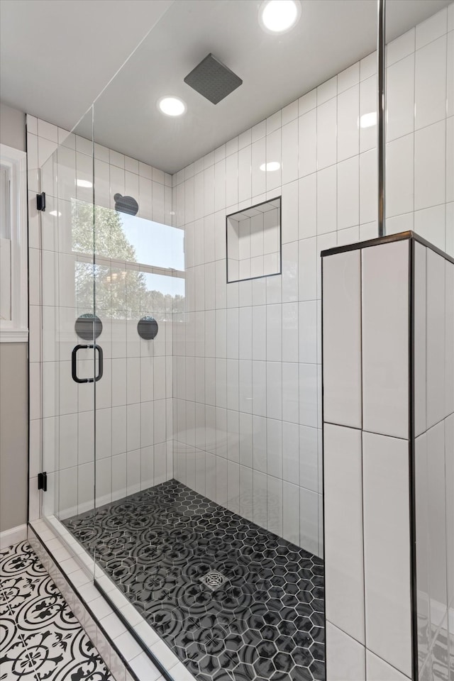 bathroom featuring tile patterned flooring and walk in shower