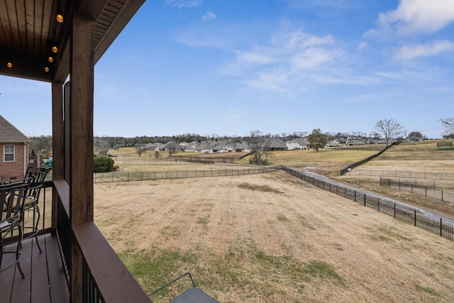 view of yard with a rural view