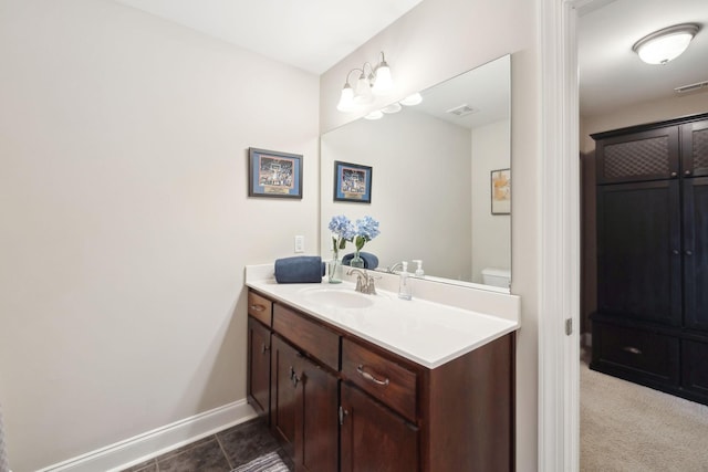 bathroom with vanity and toilet