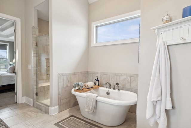 bathroom with tile walls, tile patterned floors, and plus walk in shower