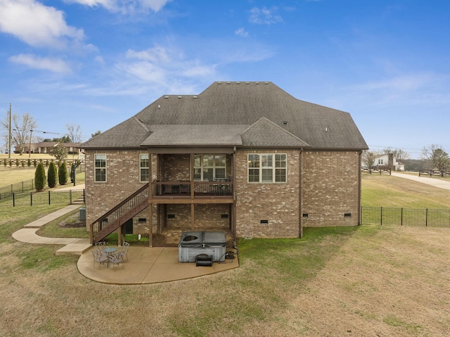 rear view of property with a yard and a patio area