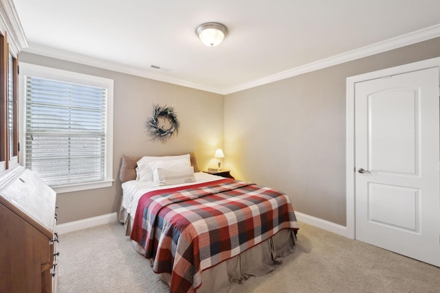 bedroom with light colored carpet and ornamental molding