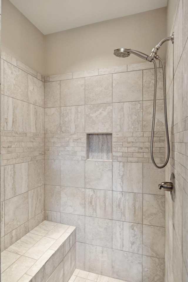 bathroom featuring tiled shower