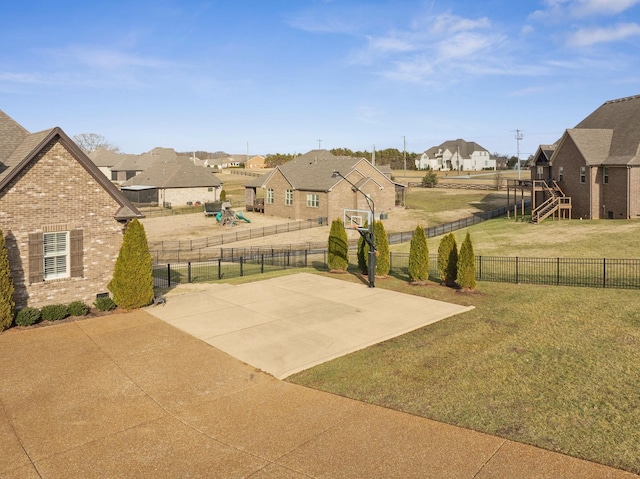 view of yard with basketball court